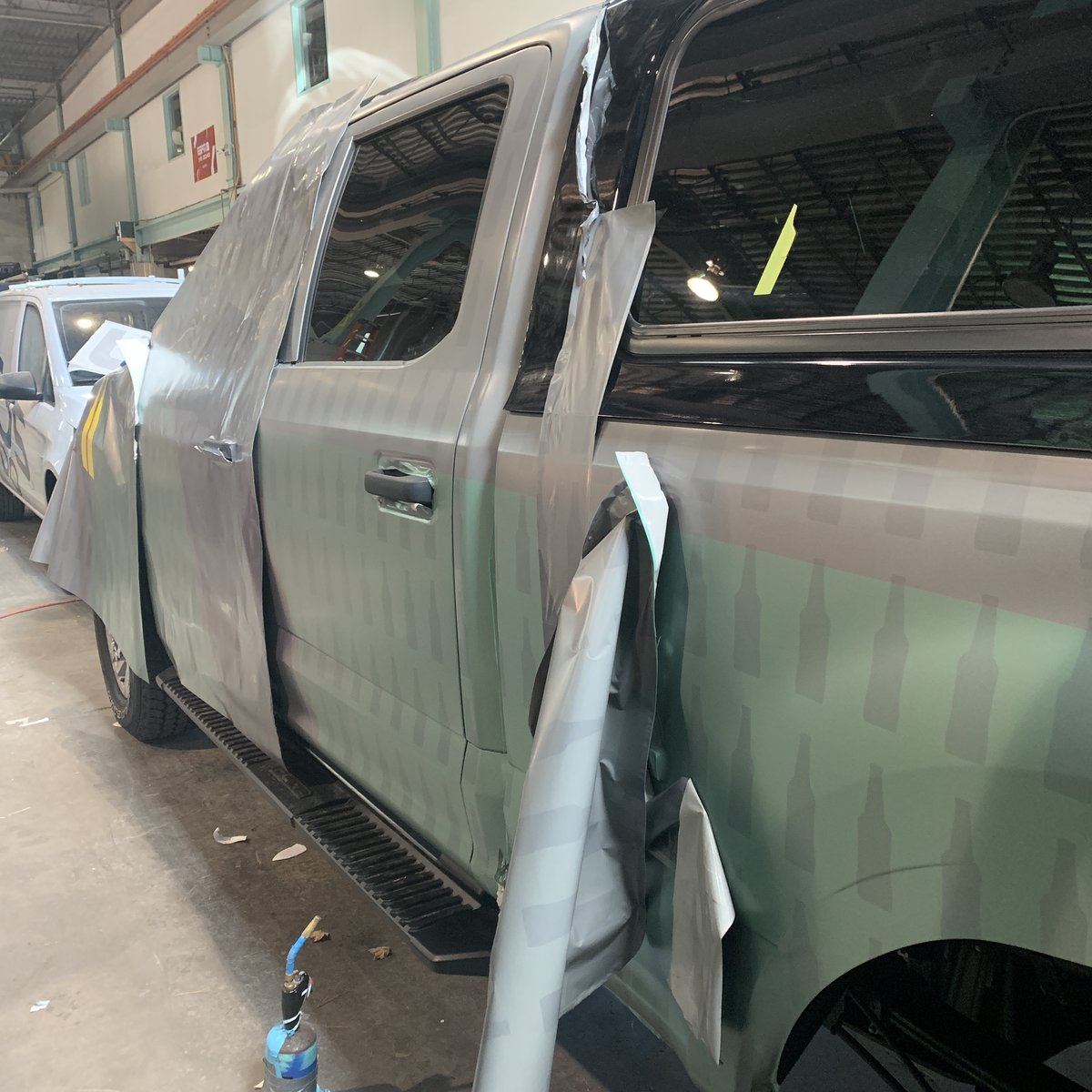 Pickup mid-install in the shop bay